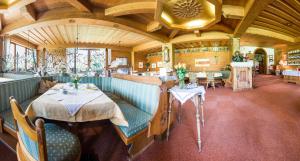 a dining room with a table in a train restaurant at Pension Grubenhof in Fulpmes