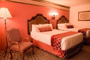 Postel nebo postele na pokoji v ubytování Business Hotel & Suites María Bonita