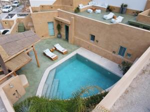 an aerial view of a house with a swimming pool at Potamos Luxury House, Private Pool, Santorini in Éxo Goniá