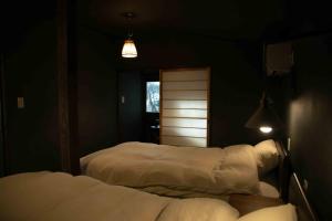 Un ou plusieurs lits dans un hébergement de l'établissement villa YUUNOBI - Vacation STAY 78559v