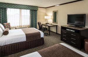 a hotel room with two beds and a television at Crowne Plaza Anchorage-Midtown, an IHG Hotel in Anchorage