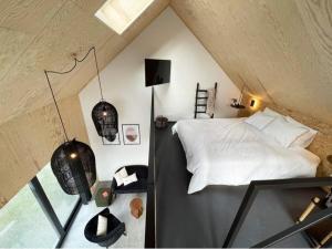 Voodi või voodid majutusasutuse Le Studio du Designer toas +9 fotot