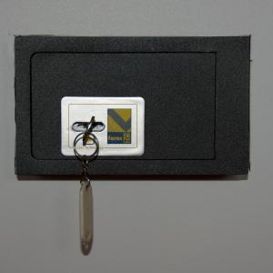 a small keychain is attached to a black case at Pensione Villa Joli in Lido di Jesolo