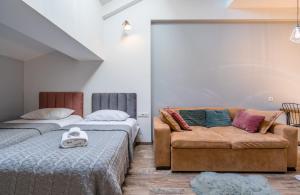 Voodi või voodid majutusasutuse New Gudauri NG Rooms toas