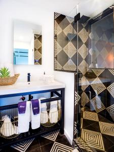 a bathroom with a sink and a mirror at Aqua by American Beech - Adults Only in Aquebogue