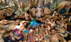 a group of people posing for a picture in a pool at Lagarto Na Banana Hostel in Pipa