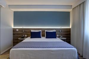 Comfort Hotel Guarulhos Aeroporto客房内的一张或多张床位