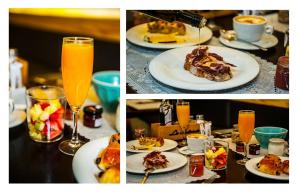 a table with plates of food and a glass of orange juice at Posada del Dragón Boutique Hotel in Madrid