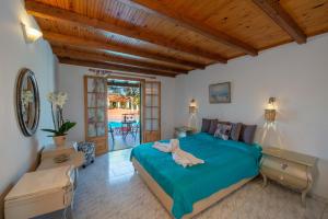 Ένα ή περισσότερα κρεβάτια σε δωμάτιο στο Georgia Apartments Sidari +55 φωτογραφίες