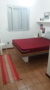 Una cama o camas en una habitación de Ubatuba-Praia Grande