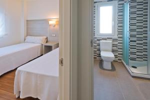 Posteľ alebo postele v izbe v ubytovaní Apartamentos Norte 14