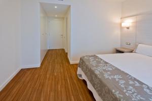 Posteľ alebo postele v izbe v ubytovaní Apartamentos Norte 14