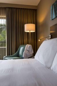 Ένα ή περισσότερα κρεβάτια σε δωμάτιο στο Radisson Blu Mammy Yoko Hotel