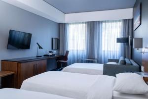 Säng eller sängar i ett rum på Radisson Hotel Cape Town Foreshore