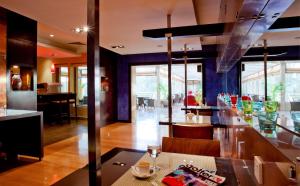 a kitchen and dining room with a table and chairs at Park Inn by Radisson Al Khobar in Al Khobar +137 photos