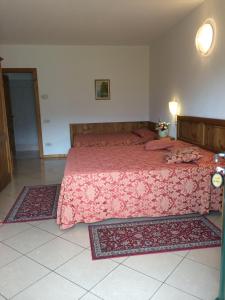 A bed or beds in a room at Albergo Rusall