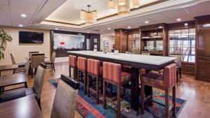 a large kitchen and dining room with a large island at Best Western Plus Lexington Inn in Lexington