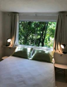 เตียงในห้องที่ Casa Rossa Bungalows & Apartments