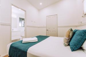 Postel nebo postele na pokoji v ubytování Woolgoolga Beach Holiday Park