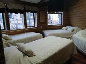 Postel nebo postele na pokoji v ubytování Hostal Copiapó Puerto Montt
