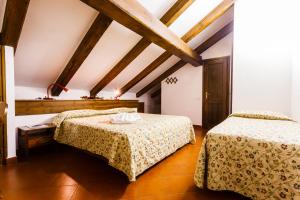 Postel nebo postele na pokoji v ubytování Hotel Biancaneve