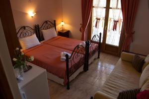 מיטה או מיטות בחדר ב-Hotel Ismini