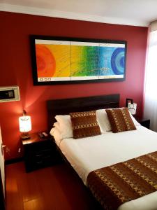 Postel nebo postele na pokoji v ubytování Hotel Fidenzi Bogotá