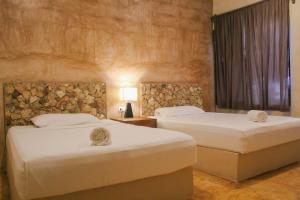 Postel nebo postele na pokoji v ubytování Hotel Nojoch Nah