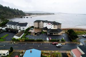 an aerial view of a parking lot next to the water at Siletz Bay Beachfront Hotel by OYO Lincoln City in Lincoln City
