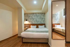 Кровать или кровати в номере HOTEL ROI-KI