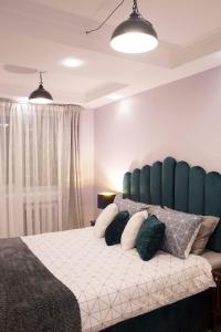 Katil atau katil-katil dalam bilik di Siauliai Apartments - Lieporiu