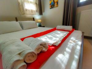 A bed or beds in a room at Sundays Family House/Studio