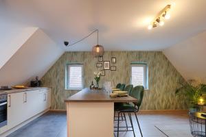 Kuchyň nebo kuchyňský kout v ubytování homie stay Julius Apartments - Iphofen