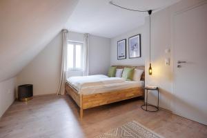 Postel nebo postele na pokoji v ubytování homie stay Julius Apartments - Iphofen