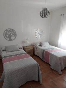 Un pat sau paturi într-o cameră la Villa Alcor