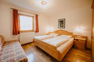 Postel nebo postele na pokoji v ubytování Peintnerhof Appartments & Zimmer