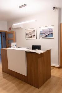 an office with a counter with a chair at a desk at Pension Kursaal in San Sebastián