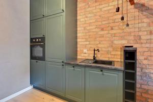 Kjøkken eller kjøkkenkrok på Grand Apartments - Browar Gdański - Design Apartment