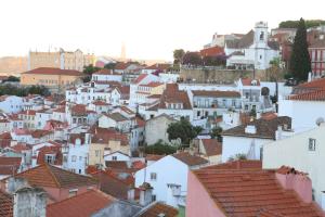 a city with white houses and roofs at Vincci Alfama in Lisbon