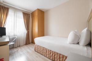 Postel nebo postele na pokoji v ubytování Crisol Almirante Bonifaz