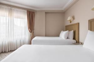 Postel nebo postele na pokoji v ubytování Crisol Almirante Bonifaz