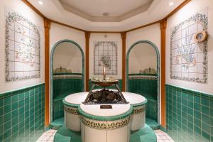 a bathroom with a sink, toilet, and bathtub at SPA Complex Luciano in Kazan
