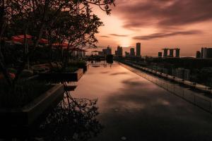 a view of a river with a city in the background at JEN Singapore Orchardgateway by Shangri-La in Singapore
