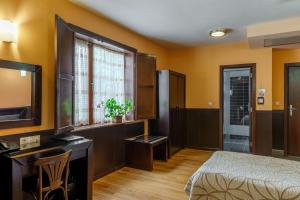 A bed or beds in a room at Hotel Ego - Free Parking - Top Central Location