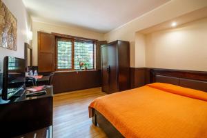 A bed or beds in a room at Hotel Ego - Free Parking - Top Central Location