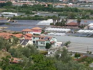 an aerial view of a village with solar panels at Agriturismo Fioredizucca in Albenga