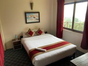 Hotel Sakura Durbarにあるベッド