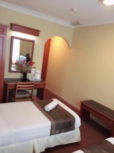Katil atau katil-katil dalam bilik di Hotel Millenium