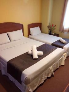 Кровать или кровати в номере Hotel Millenium