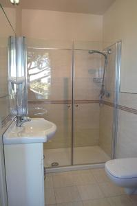 a bathroom with a shower and a sink and a toilet at Hotel Marbella in Cervia +62 photos